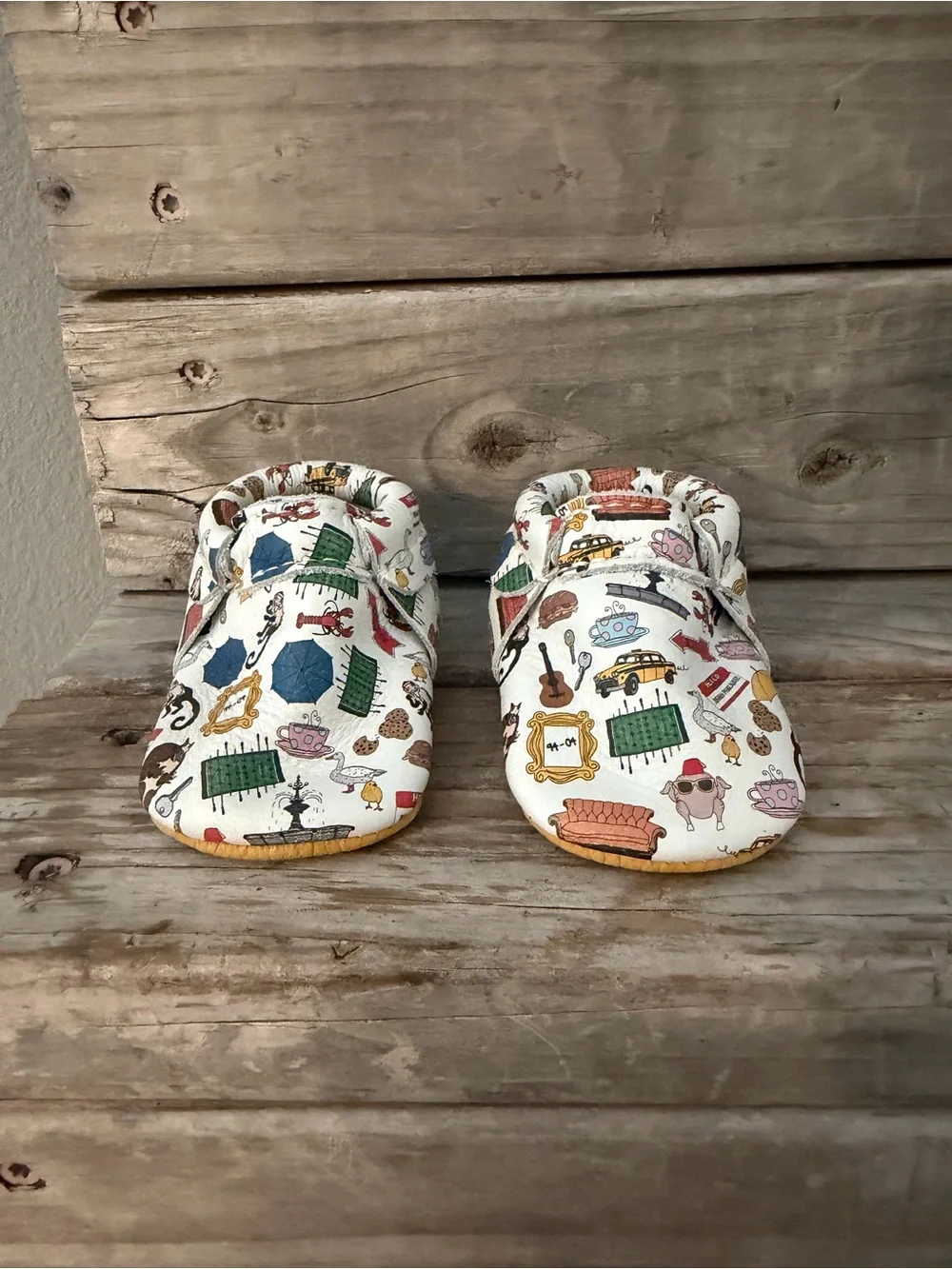 Freshly Picked “Friends” White Baby Moccasins with Multicolor Home Icons